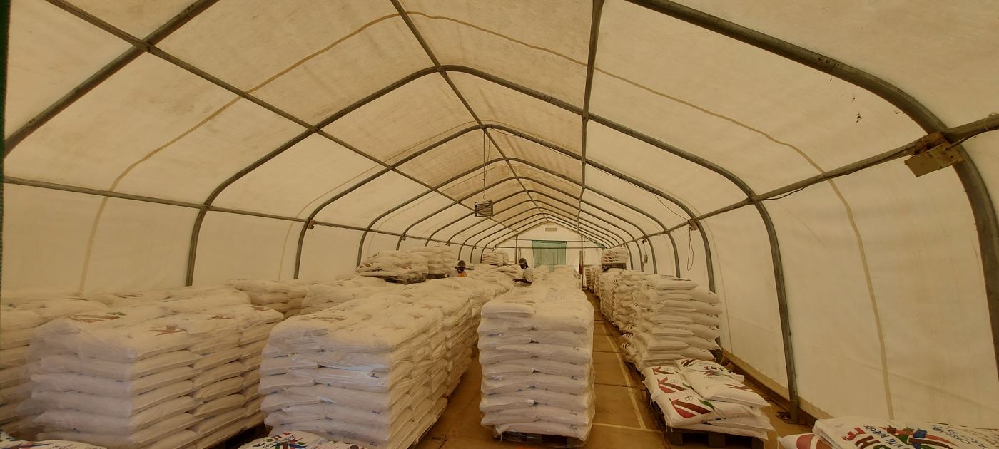 Palletised bags of cassava starch in a storage hall